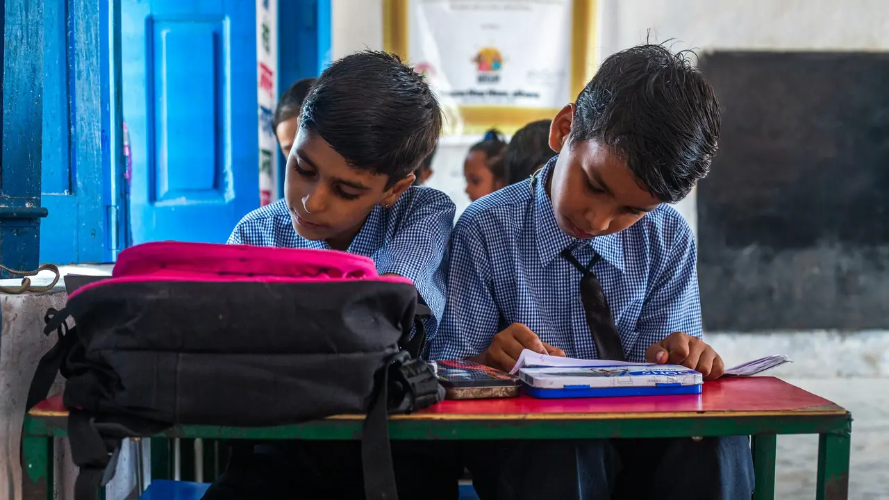 Two children studying in a classroom