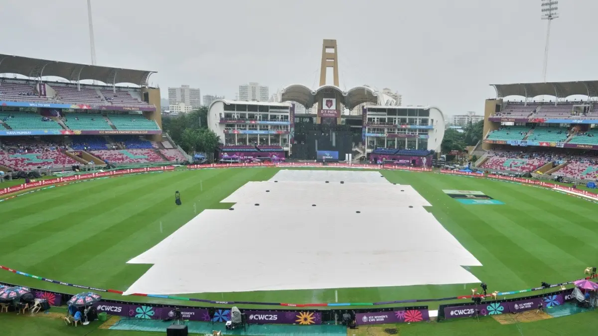 The pitch area is covered with plastic sheets as it rains ahead of the Women's World Cup 2025 Final in Navi Mumbai