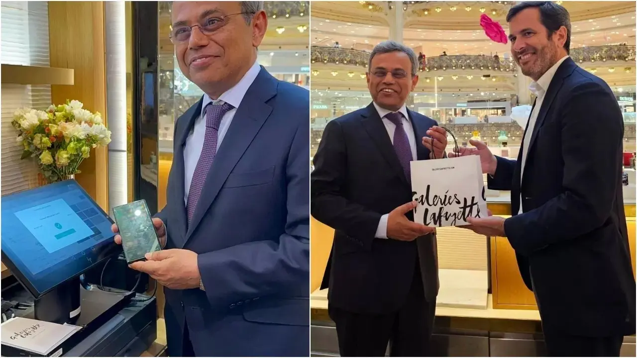 UPI to be Accepted at Paris’s Luxurious Galeries Lafayette Ahead of Olympics Ambassador to France, Jawed Ashraf demonstrating a UPI payment.