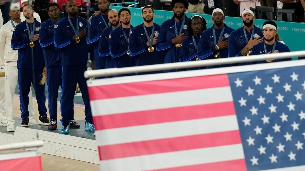 List of US Universities Which Sent the Most Athletes to Paris Olympics 2024? Stanford Leads the Way USA players sing National Anthem at the Paris Olympics podium