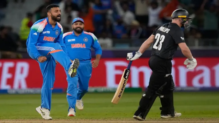 Varun Chakaravarthy celebrates a wicket