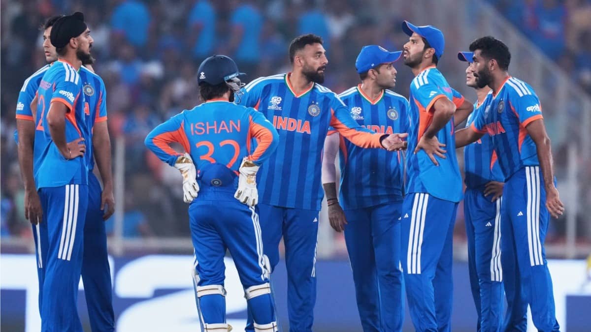 Varun Chakaravarthy celebrating with his teammates after taking a wicket against Netherlands