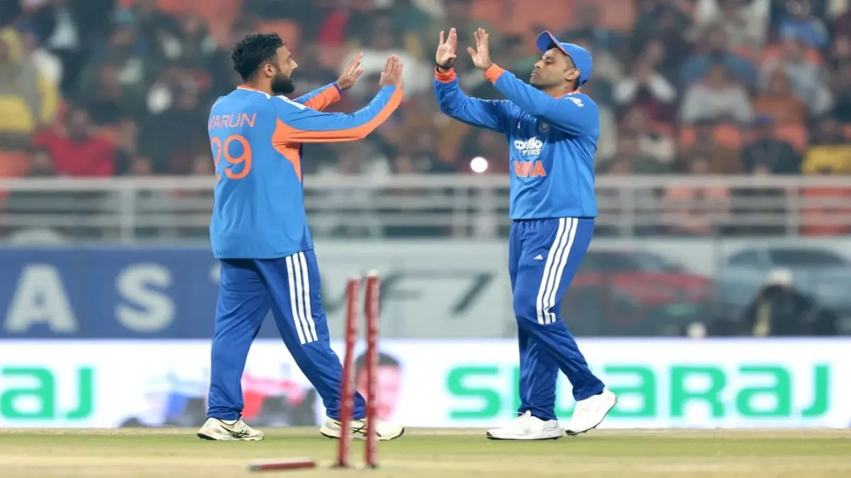 Varun Chakravarthy and Suryakumar Yadav celebrate a wicket