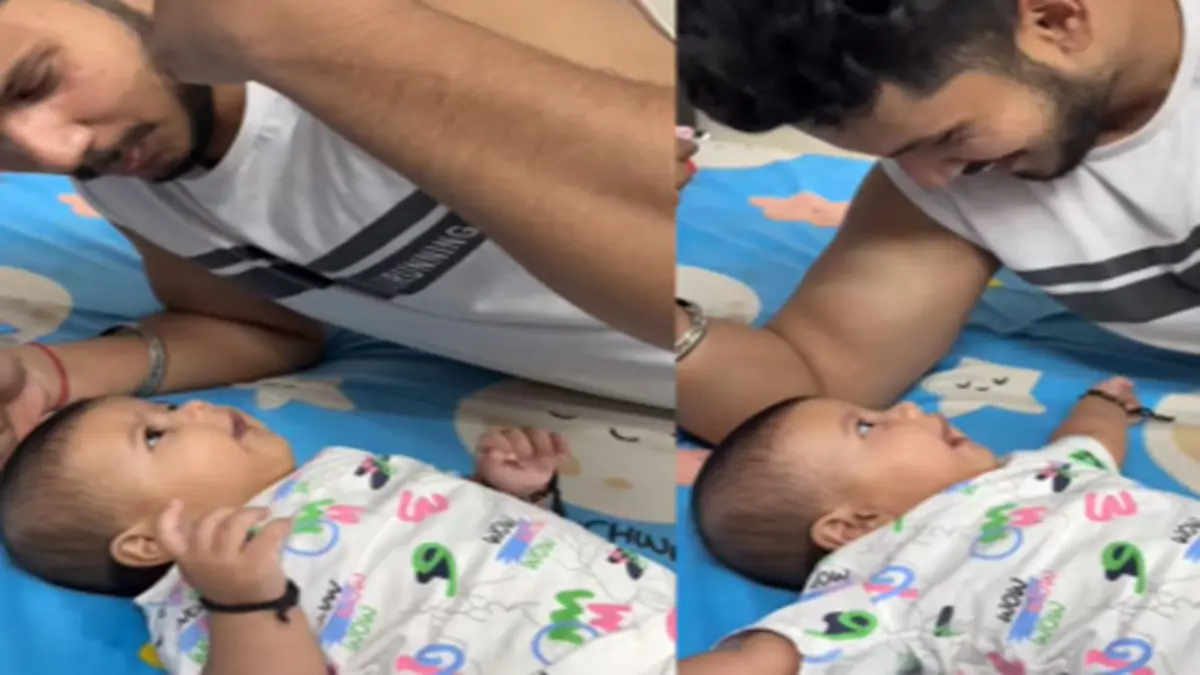 Viral Video: Adorable Baby Girl's Response to Father’s Muscle Talk Wins Hearts on Social Media