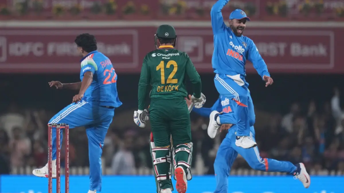 Virat Kohli and Harshit Rana celebrate the fall of Quinton de Kock's wicket