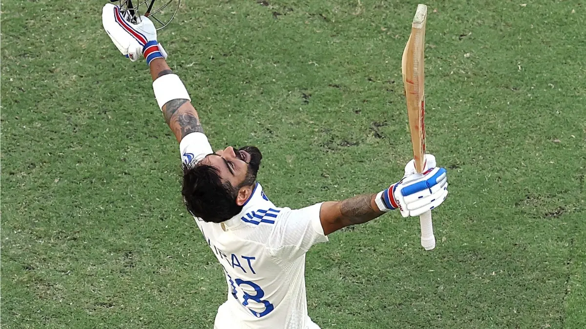 Virat Kohli celebrates his century in the first Test match against Australia in the BGT 2024-2025