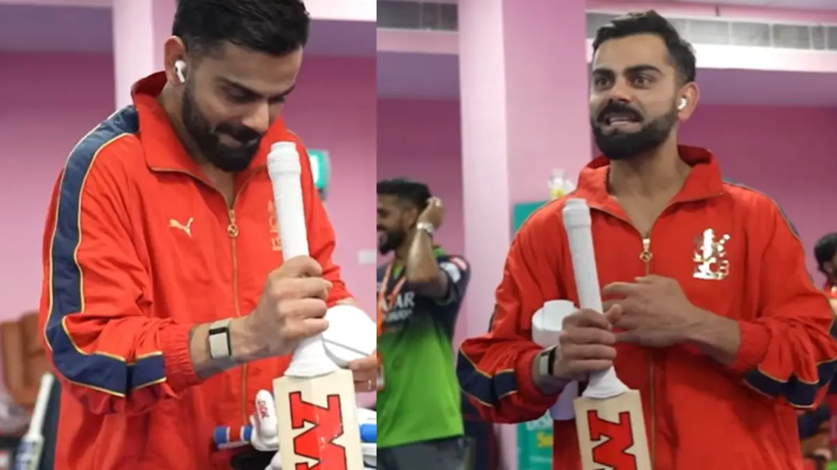 Virat Kohli checks his bats in the RCB dressing room