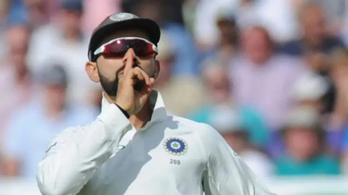 Virat Kohli gesturing to the crowd during a Test match