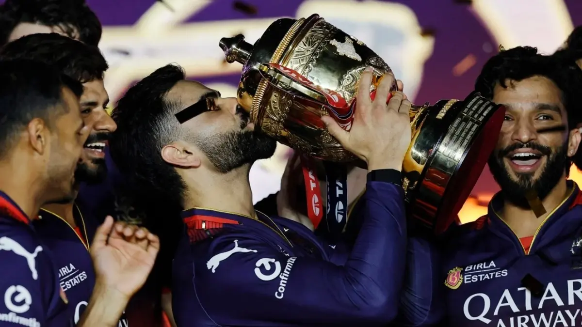 Poetic End To Virat Kohli's Wait For First IPL Trophy As Jersey Number 18. Wins Maiden Title In His 18th Season Virat Kohli kisses the IPL trophy