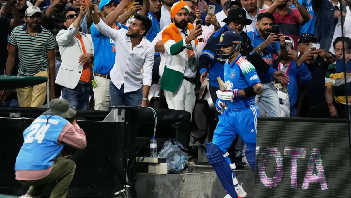 Virat Kohli walks out to bat in Sydney
