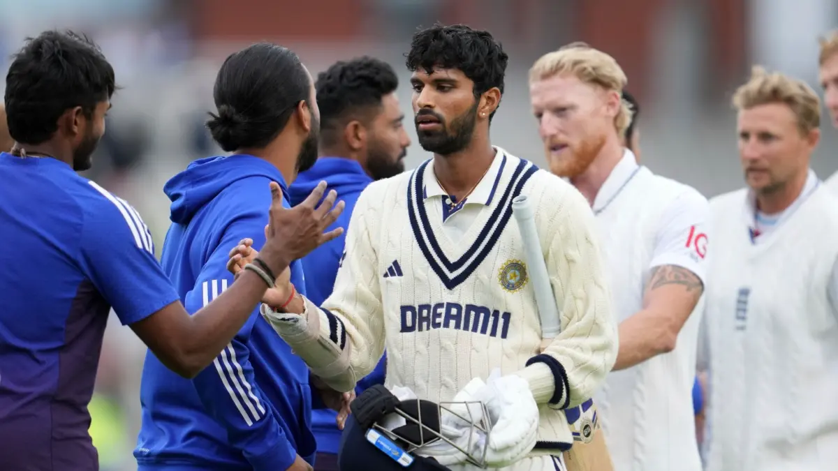 Washington Sundar, Ben Stokes and Joe Root shake hands with the Indian support staff after the Manchester Test ends in a draw
