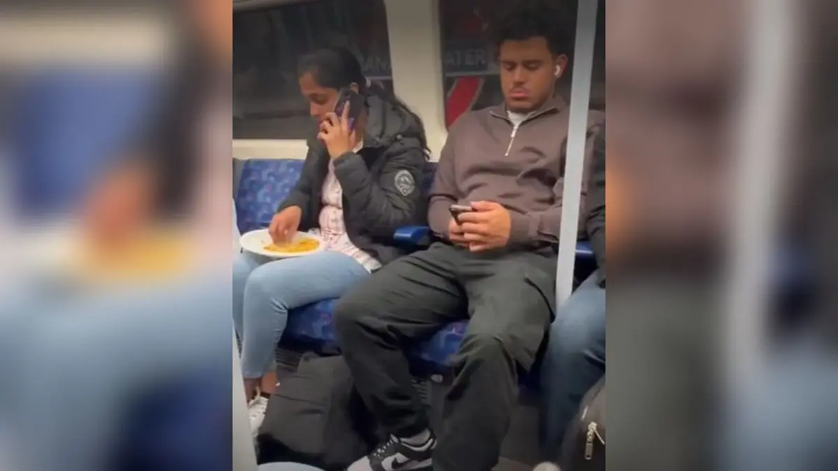 Woman mocked for eating with hands on a London metro.