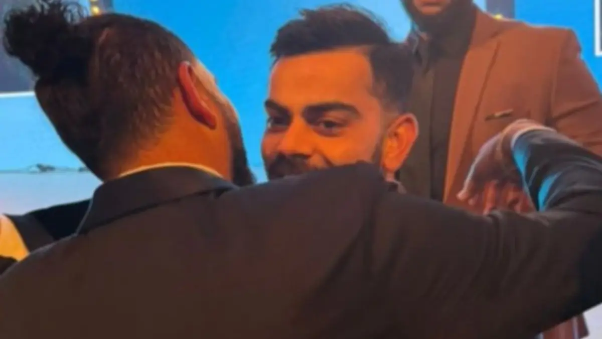 Yuvraj hugs Kohli at a London Event