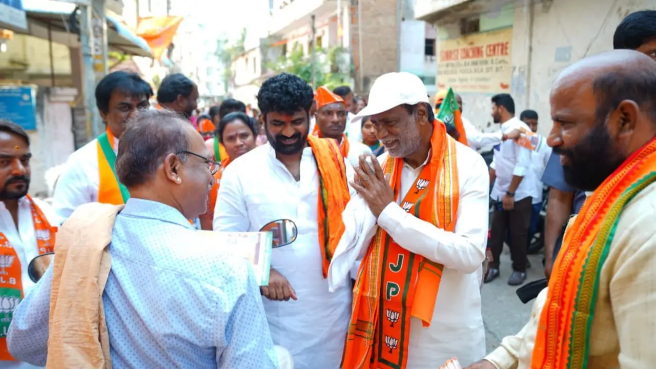 rajya sabha mp k laxman (white cap)