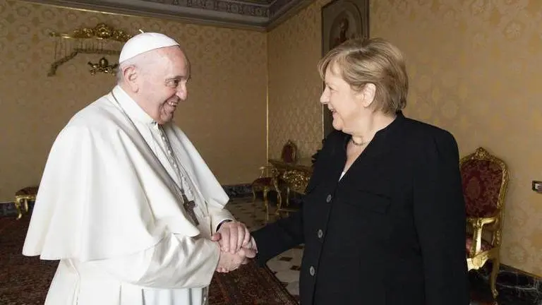 Divert arms money for food, vaccines: Pope at peace meet with Angela Merkel Angela Merkel