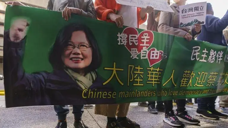 Supporters of Taiwan's President Tsai Ing-wen await her arrival outside The Westin Bonaventure Hotel in Los Angeles Tuesday,