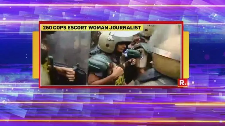 Sabarimala: Two Women accompanied by 250-strong police escort 1 km away from Sabarimala Temple gates. LIVE UPDATES here Sabarimala: Two Women accompanied by 250-strong police escort 1 km away from Sabarimala Temple gates. LIVE UPDATES here
