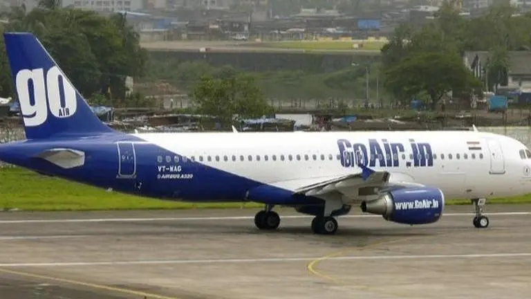 GoAir withdraws boarding passes with photos of Prime Minister Narendra Modi, Gujarat Chief Minister Vijay Rupani GoAir withdraws boarding passes with photos of Prime Minister Narendra Modi, Gujarat Chief Minister Vijay Rupani