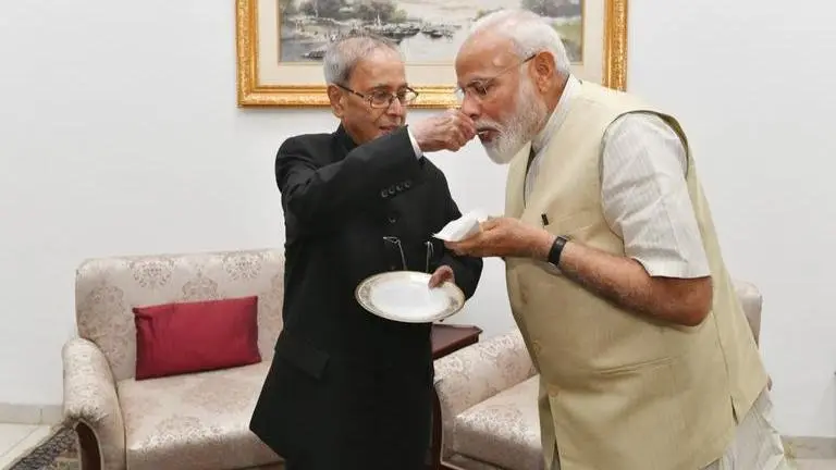 PM Modi meets Pranab Mukherjee ahead of second term, reserves high praise for former President's knowledge and insights PM Modi meets Pranab Mukherjee ahead of second term, reserves high praise for former President's knowledge and insights