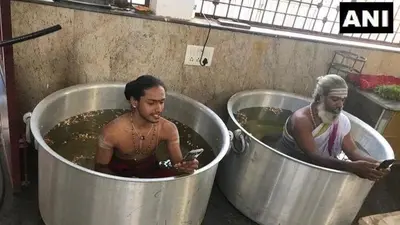 Appealing to the Rain Gods, priests in Karnataka temple perform rituals immersed in massive water-filled vessels Appealing to the Rain Gods, priests in Karnataka temple perform rituals immersed in massive water-filled vessels