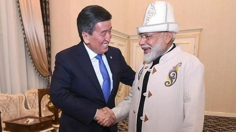 IN PICTURES | PM Narendra Modi receives traditional hat and coat from Kyrgyzstan President Jeenbekov in Bishkek