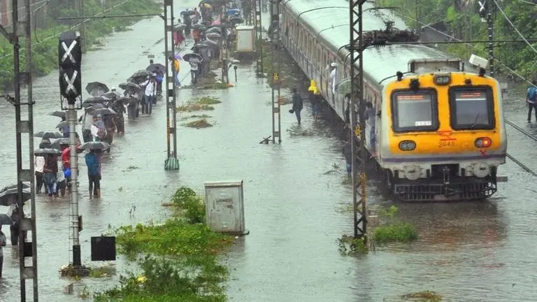 Heavy rainfall brings Mumbai to a standstill, public holiday declared as traffic, train services affected. LIVE updates here Heavy rainfall brings Mumbai to a standstill, public holiday declared as traffic, train services affected. LIVE updates here