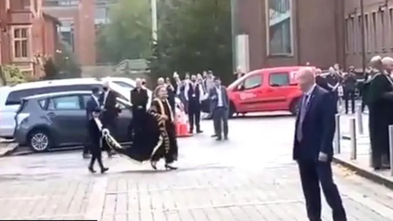 Crowd boos Hillary Clinton as she attends Queen University's programme as chancellor war criminal
