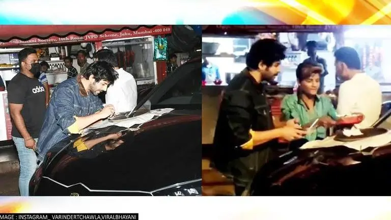 Kartik Aaryan stops at roadside food stall, savours Chinese food on his Lamborghini; Watch Kartik Aaryan, Dhamaka promotions, Dhamaka release date, Kartik at Chinese food stall