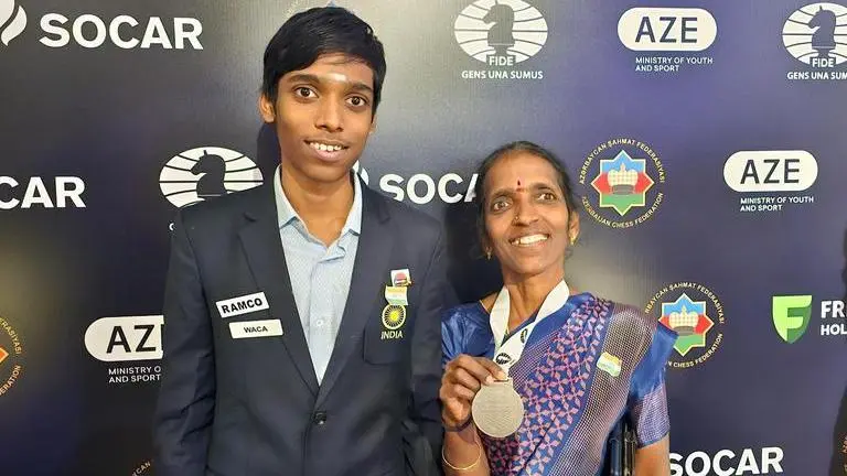 R Praggnanandhaa adorable image with his mother featuring Chess World Cup medal R Praggnanandhaa adorable image with his mother featuring Chess World Cup medal