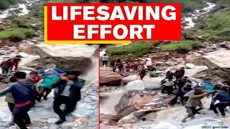 Uttarakhand Villagers carry patient on makeshift stretcher; brave landslide and cloudburst Uttarakhand