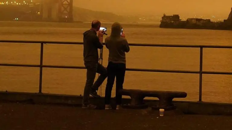 Massive smoke clouds, thick air darken Western US skies