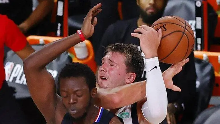 Doncic's debut good enough for history, but not for a win