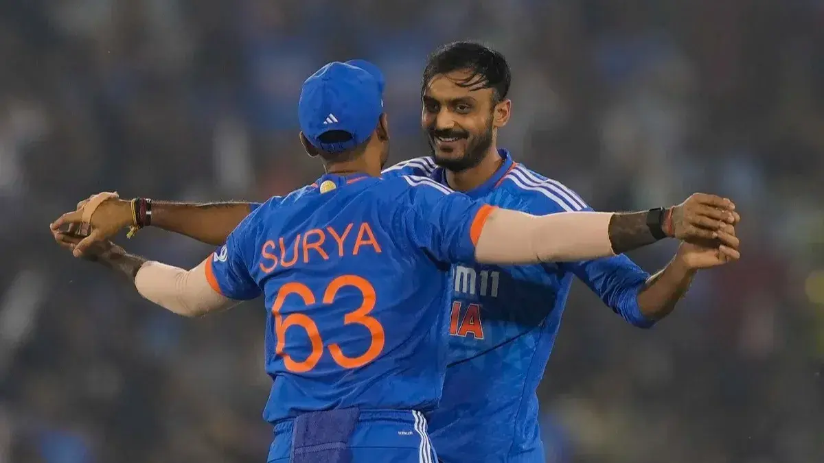 Axar Patel and Suryakumar Yadav hug it out as they celebrate after taking a wicket