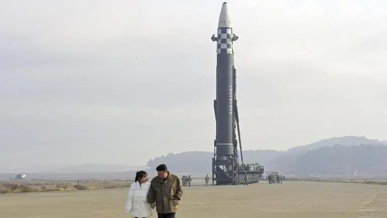 North Korea unveils Kim Jong Un's daughter at missile launch site