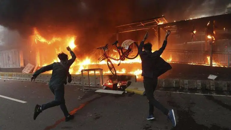 Indonesia's student protests turn violent over new labour law, police fire tear gas Indonesia