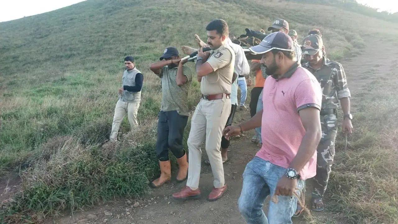 Trekker dies of heart attack atop Karnataka’s Tadiandamol peak | Deets here Deceased Jathimn's body being brought down by officials on a stretcher