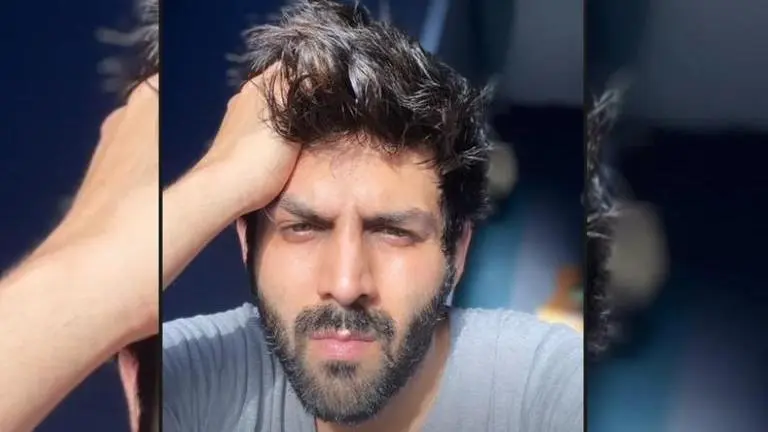 Kartik Aaryan awaits COVID-19 test report with feline friend, asks fans to guess result Source: Kartik Aaryan Instagram