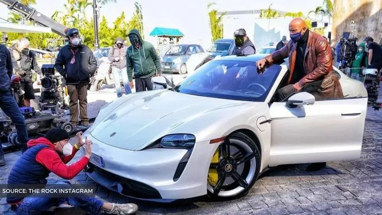 Dwayne Johnson hilariously struggled to fit inside a Porsche Taycan during film shoot Dwayne Johnson