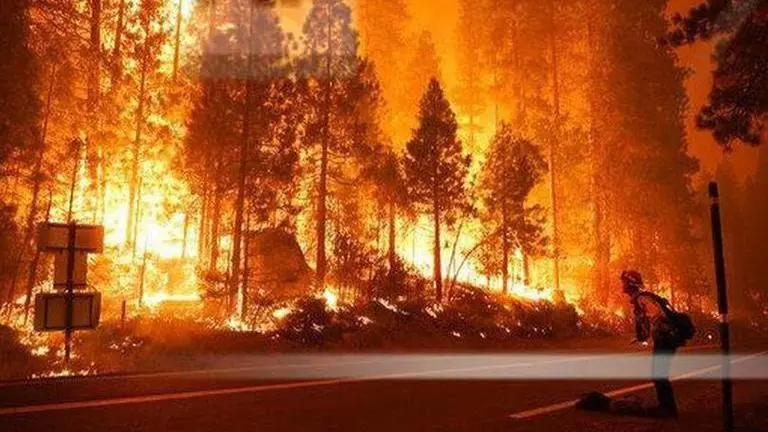 California: Thousands battle power cuts as storm exacerbates wildfires