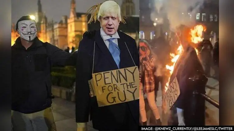 London's 'Million Mask March' protesters burn effigy of UK PM Boris Johnson London