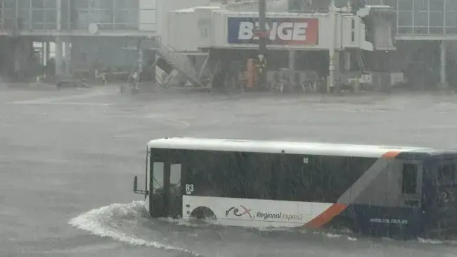 Flash floods batter Sydney Airport on Christmas Eve