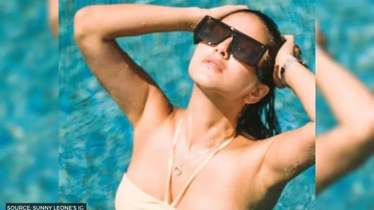 Sunny Leone flaunts her custom made hat as she sun bathes in her pool Sunny Leone