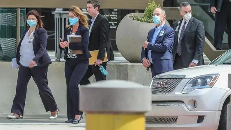 France weighs mask mandate at work as virus reawakens