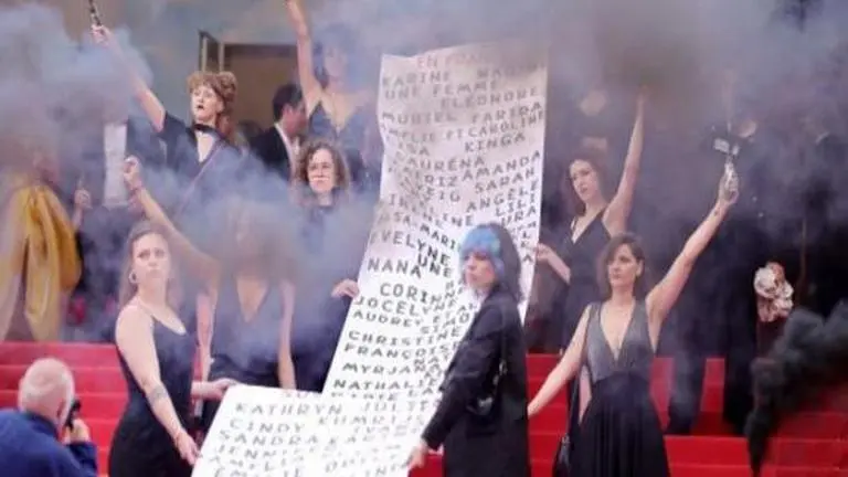 Cannes 2022: Female protesters demonstrate against domestic violence, release smoke bombs Cannes 2022, female protestors at Cannes, Cannes Film Festival, Female protestors release smoke grenade