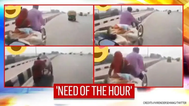 Video: Biker helps couple in pulling rickshaw; netizens applaud his efforts | WATCH Biker