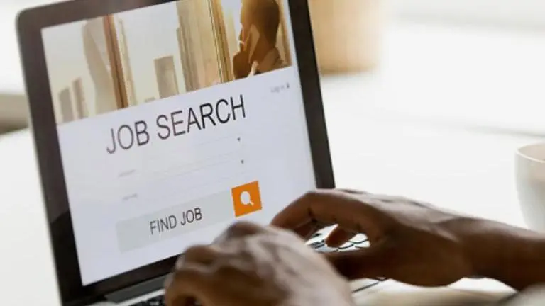 UK man finds job standing on London Tube station with QR code to his CV, placards UK