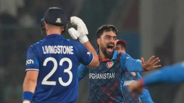 Rashid Khan celebrates the dismissal of Liam Livingstone.