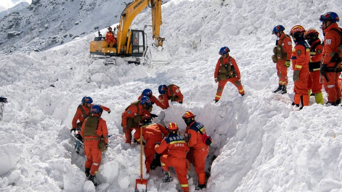 Tourists stranded as a result of avalanches hitting highways are airlifted to safety by helicopter in Burqin County, Xinjiang province, China