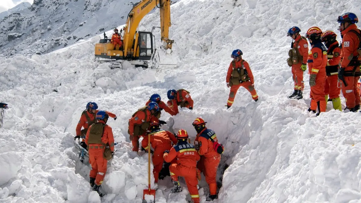 Tourists stranded as a result of avalanches hitting highways are airlifted to safety by helicopter in Burqin County, Xinjiang province, China