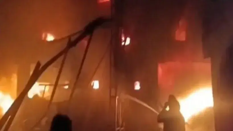 authorities suspecting at least one person to be trapped inside, according to the police in Angamally.